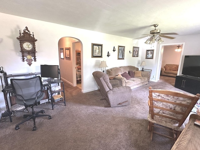 210 W S St, Sheffield, IL 61361 - carpeted living room featuring arched walkways and a ceiling fan