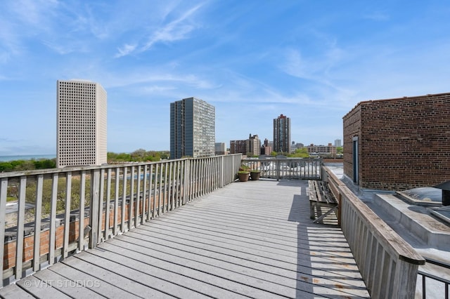 wooden deck with a city view