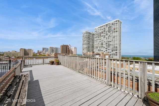 wooden deck featuring a view of city