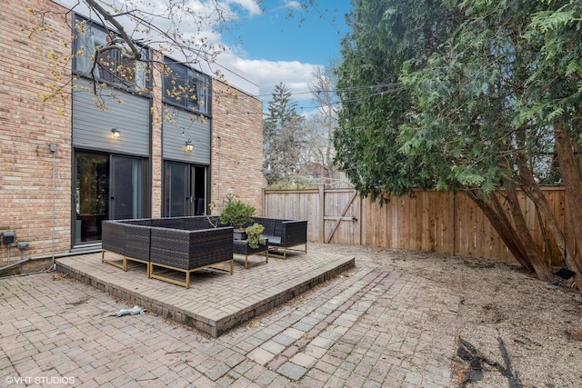 2751 Prairie Ave, Evanston, IL 60201 - fenced backyard featuring a gate, a patio, and outdoor lounge area