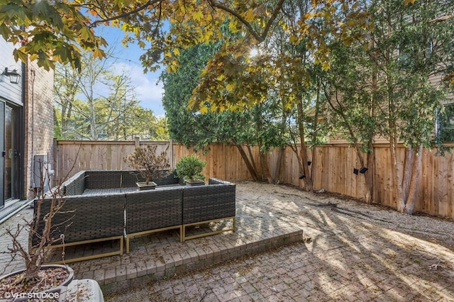 2751 Prairie Ave, Evanston, IL 60201 - fenced backyard featuring an outdoor hangout area and a patio
