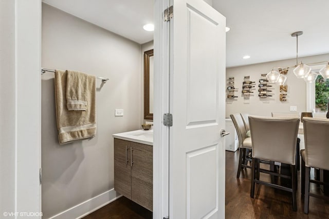 2751 Prairie Ave, Evanston, IL 60201 - bathroom with vanity, wood finished floors, baseboards, and recessed lighting
