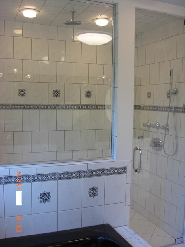 full bathroom with a stall shower