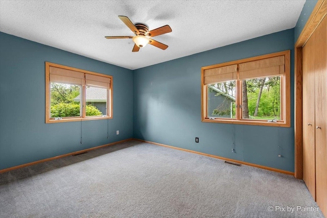 118 Centralia Pl, Poplar Grove, IL 61065 - carpeted empty room featuring a ceiling fan, a textured ceiling, and baseboards