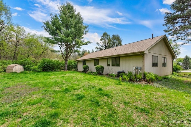 118 Centralia Pl, Poplar Grove, IL 61065 - rear view of house with a storage unit, a yard, and an outdoor structure