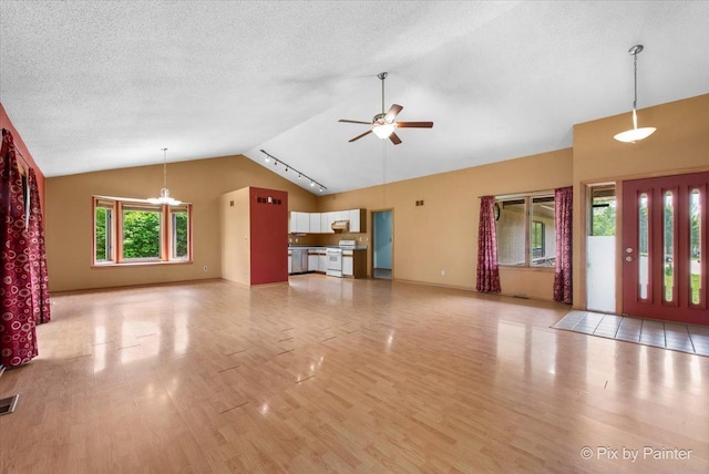118 Centralia Pl, Poplar Grove, IL 61065 - unfurnished living room featuring wood finished floors, a ceiling fan, and high vaulted ceiling