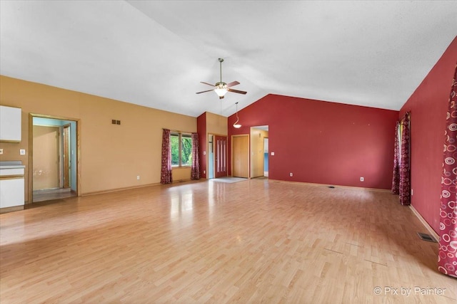118 Centralia Pl, Poplar Grove, IL 61065 - unfurnished living room featuring a ceiling fan, light wood finished floors, lofted ceiling, and baseboards