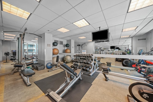 gym with carpet flooring and a drop ceiling