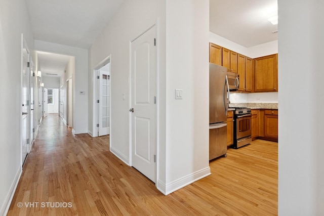4727 N Clark St Unit 2S, Chicago, IL 60640 - hallway with light wood-style floors and baseboards