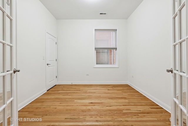 4727 N Clark St Unit 2S, Chicago, IL 60640 - unfurnished bedroom with light wood-style flooring and french doors