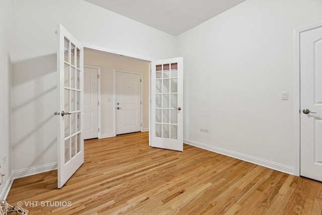 4727 N Clark St Unit 2S, Chicago, IL 60640 - spare room featuring french doors and light wood-style floors