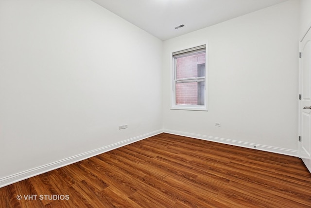 4727 N Clark St Unit 2S, Chicago, IL 60640 - spare room with dark wood-style floors and baseboards