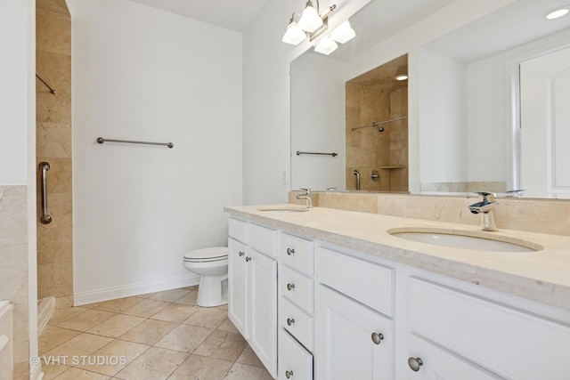 4727 N Clark St Unit 2S, Chicago, IL 60640 - bathroom featuring a tile shower, double vanity, and tile patterned floors
