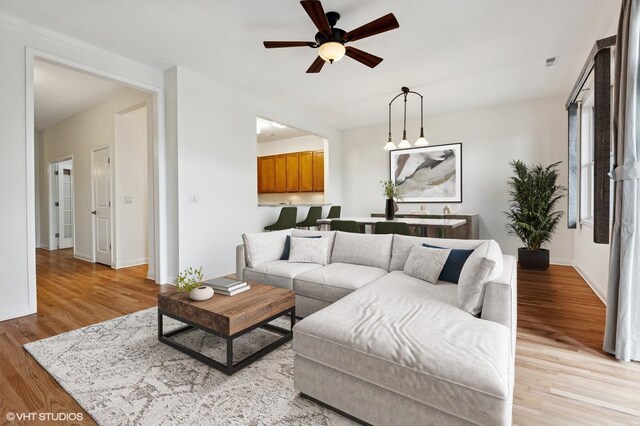 4727 N Clark St Unit 2S, Chicago, IL 60640 - living room featuring ceiling fan and light wood-style flooring