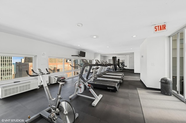 workout area featuring recessed lighting