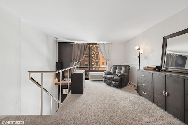 living area featuring carpet and an upstairs landing