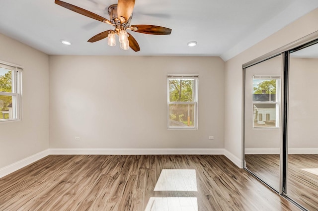 11311 S Stewart Ave, Chicago, IL 60628 - unfurnished bedroom with a closet, light wood finished floors, baseboards, and recessed lighting