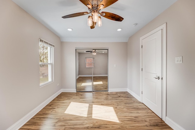 11311 S Stewart Ave, Chicago, IL 60628 - unfurnished bedroom with light wood finished floors, baseboards, a ceiling fan, recessed lighting, and a closet