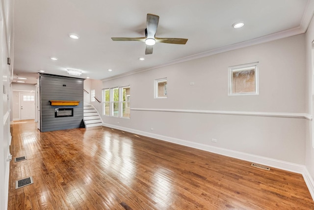 11311 S Stewart Ave, Chicago, IL 60628 - unfurnished living room with baseboards, ceiling fan, ornamental molding, wood finished floors, and stairway