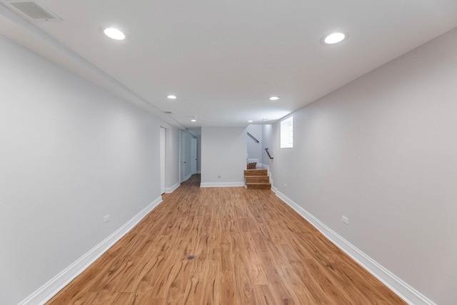 11311 S Stewart Ave, Chicago, IL 60628 - below grade area featuring light wood finished floors, recessed lighting, baseboards, and stairs
