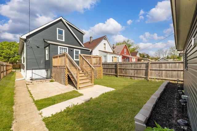 11311 S Stewart Ave, Chicago, IL 60628 - rear view of house with a wooden deck and a patio area