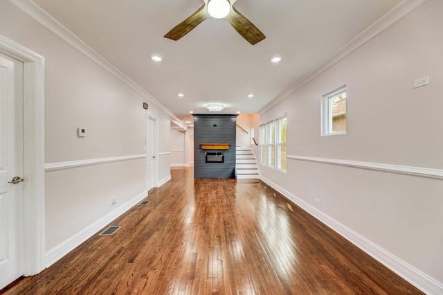11311 S Stewart Ave, Chicago, IL 60628 - unfurnished living room with ornamental molding, ceiling fan, baseboards, wood finished floors, and recessed lighting