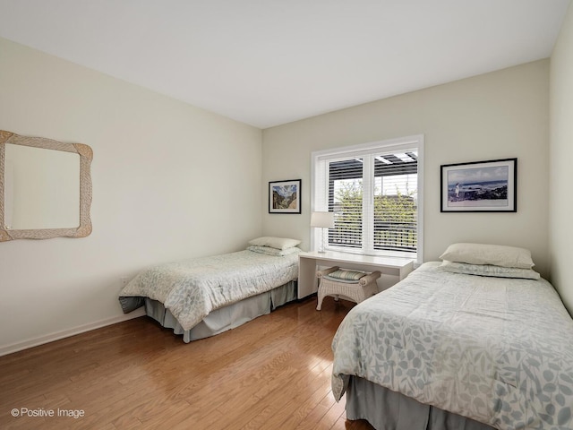 131 W Adelaide St Unit 308, Elmhurst, IL 60126 - bedroom featuring light wood-style floors and baseboards