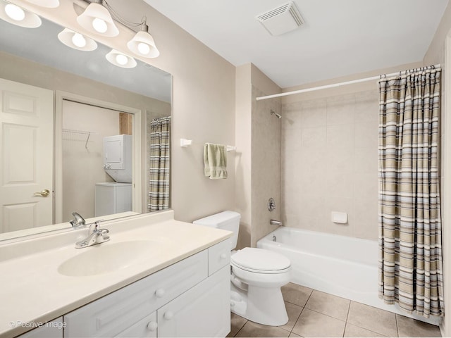 131 W Adelaide St Unit 308, Elmhurst, IL 60126 - bathroom with stacked washer / drying machine, tile patterned flooring, shower / bath combo, toilet, and vanity