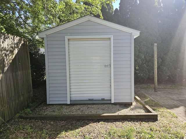view of shed with fence