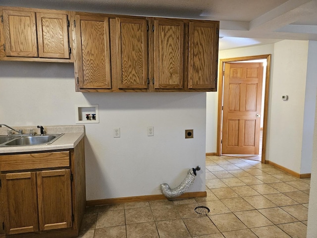 laundry area with electric dryer hookup, cabinet space, washer hookup, and baseboards