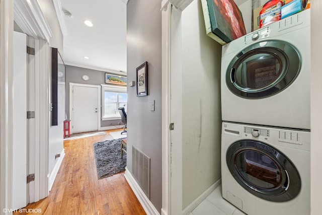 2451 S Western Ave Unit 3N, Chicago, IL 60608 - laundry room with stacked washer and clothes dryer, baseboards, light wood-type flooring, and recessed lighting