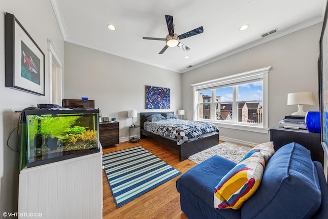 2451 S Western Ave Unit 3N, Chicago, IL 60608 - bedroom with wood finished floors, ornamental molding, recessed lighting, ceiling fan, and baseboards