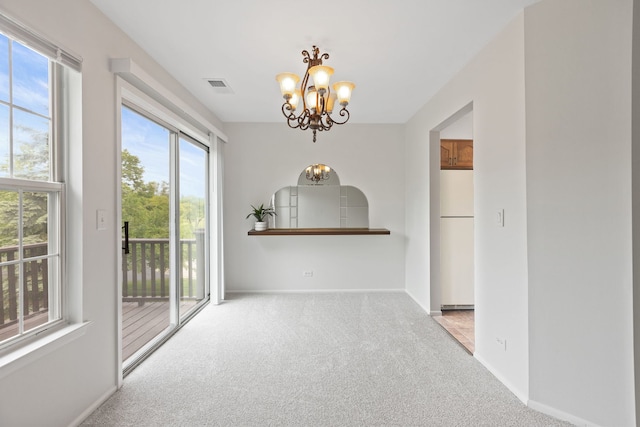 283 E Fabish Dr, Buffalo Grove, IL 60089 - carpeted spare room with a chandelier and baseboards