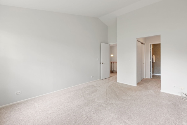 283 E Fabish Dr, Buffalo Grove, IL 60089 - spare room featuring light colored carpet, high vaulted ceiling, and baseboards