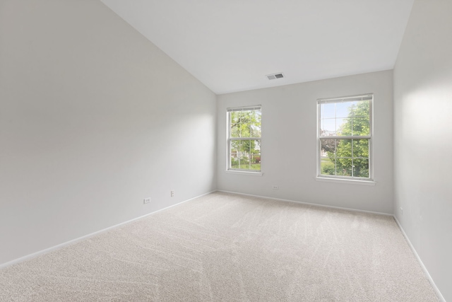 283 E Fabish Dr, Buffalo Grove, IL 60089 - empty room featuring vaulted ceiling, light carpet, and baseboards