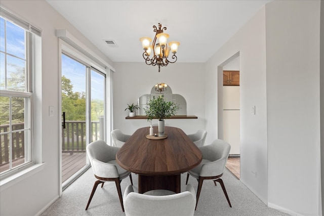 283 E Fabish Dr, Buffalo Grove, IL 60089 - dining area featuring a chandelier, carpet floors, and baseboards