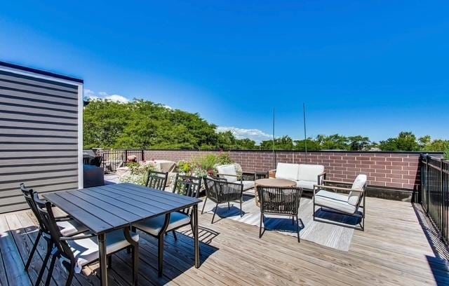 deck with an outdoor hangout area and outdoor dining space