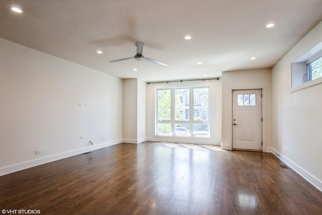 unfurnished living room with ceiling fan, recessed lighting, dark wood-style floors, and baseboards