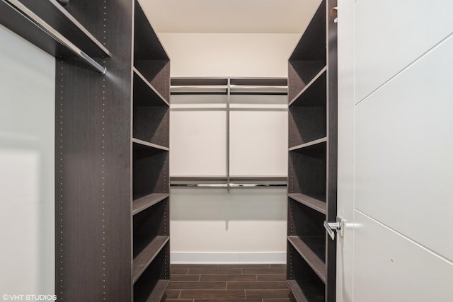 spacious closet featuring wood finish floors