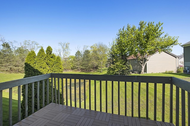wooden deck with a yard