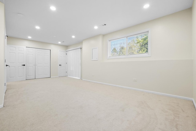 basement with baseboards, carpet floors, and recessed lighting
