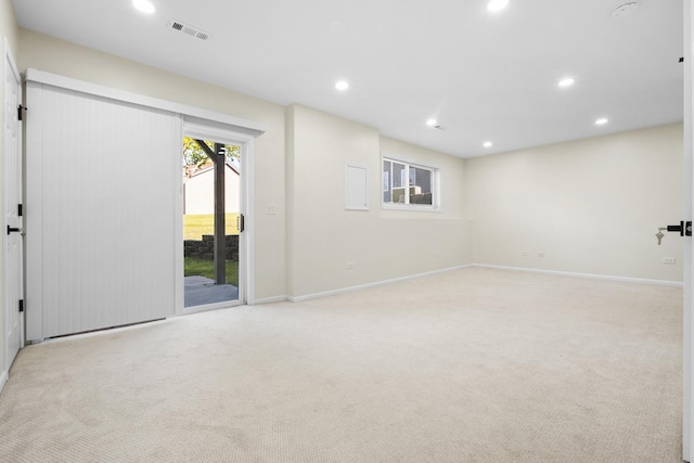 carpeted empty room with recessed lighting and baseboards
