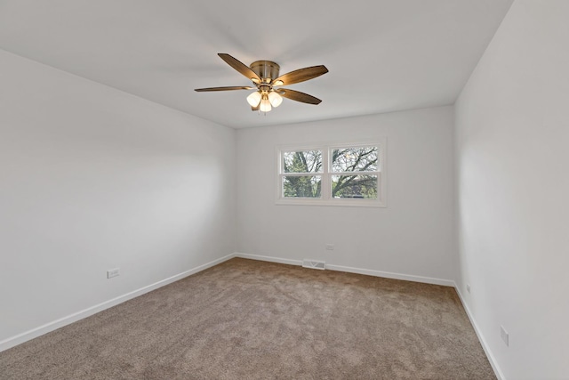 unfurnished room with carpet, ceiling fan, and baseboards