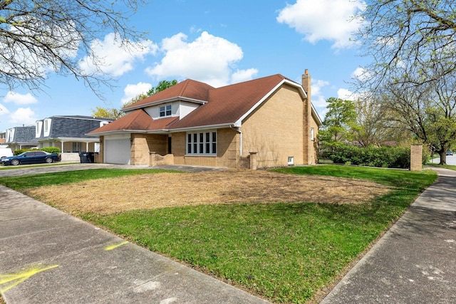 view of front of home with asphalt driveway, an attached garage, brick siding, a front yard, and a chimney