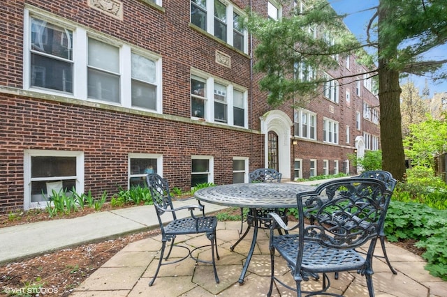 1225 W Jarvis Ave Unit 3, Chicago, IL 60626 - view of patio featuring outdoor dining area