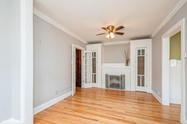 1225 W Jarvis Ave Unit 3, Chicago, IL 60626 - unfurnished living room featuring a ceiling fan, light wood-style flooring, a fireplace with flush hearth, ornamental molding, and baseboards