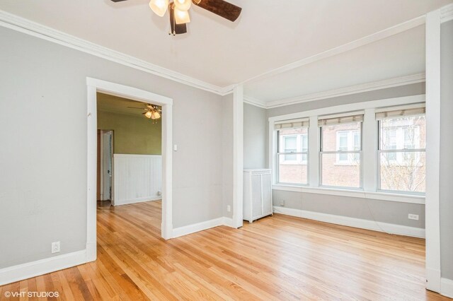 1225 W Jarvis Ave Unit 3, Chicago, IL 60626 - unfurnished room featuring a ceiling fan, ornamental molding, light wood-style flooring, baseboards, and a wainscoted wall