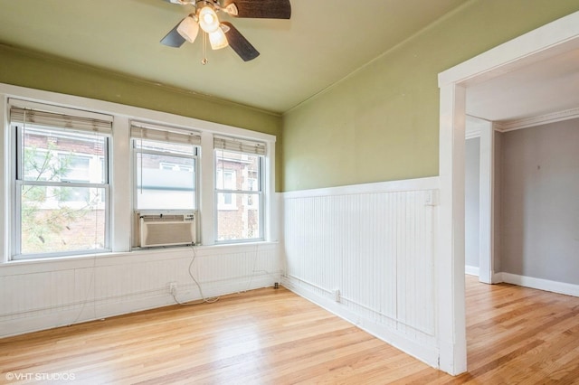 1225 W Jarvis Ave Unit 3, Chicago, IL 60626 - unfurnished room featuring wood finished floors, a wainscoted wall, healthy amount of natural light, ceiling fan, and crown molding