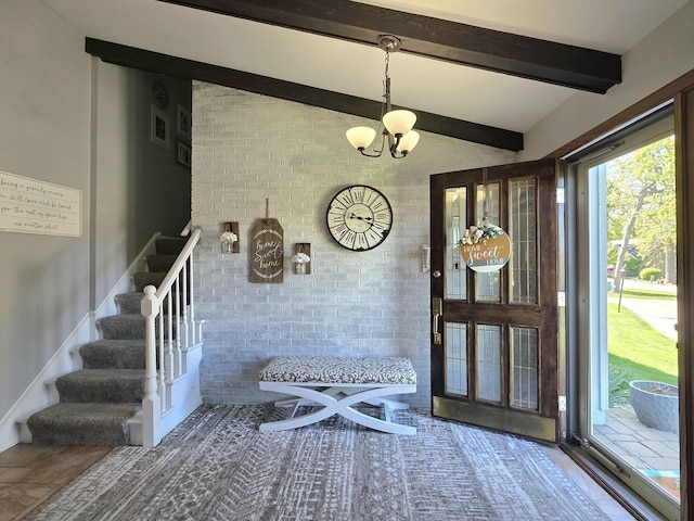 574 Aberdeen Rd, Frankfort, IL 60423 - entryway with brick wall, stairs, and a chandelier