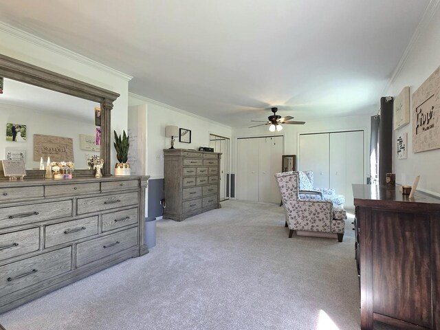574 Aberdeen Rd, Frankfort, IL 60423 - bedroom with ornamental molding, light colored carpet, two closets, and ceiling fan